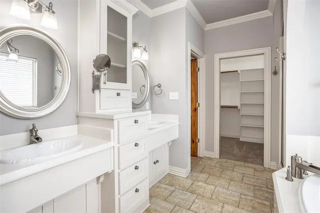 a bathroom with a sink double vanity and a mirror