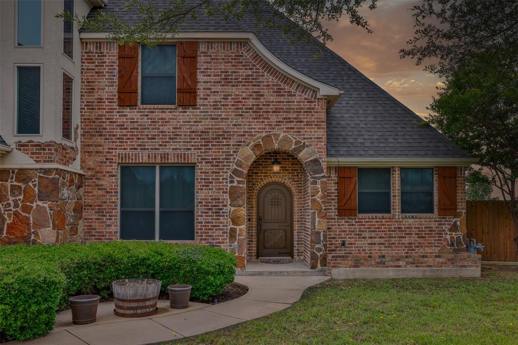 1218 Walter Street Lindsay, TX 76240 - Photo 2 of 40 a front view of a house with a garden
