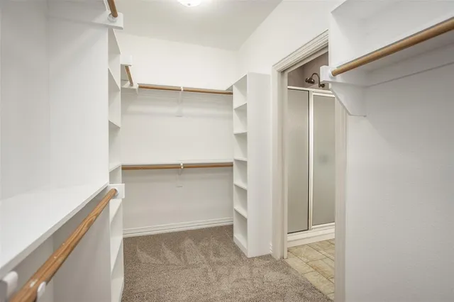 a view of an empty walk in closet