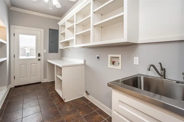 a kitchen with a sink and cabinets