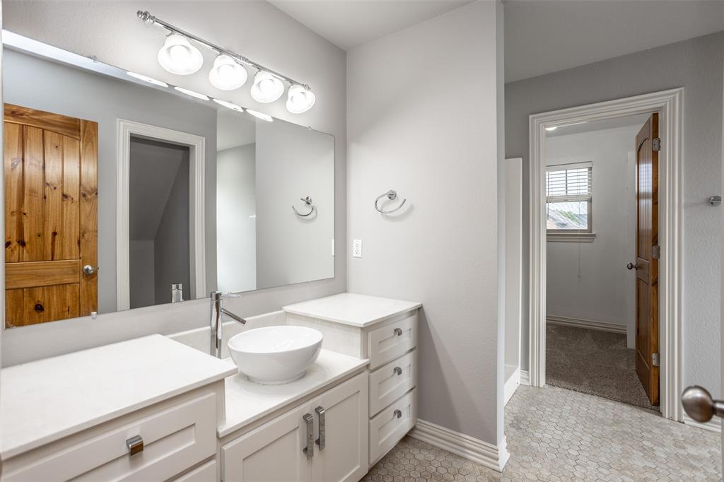 1218 Walter Street Lindsay, TX 76240 - Photo 26 of 40 a bathroom with a sink and a mirror
