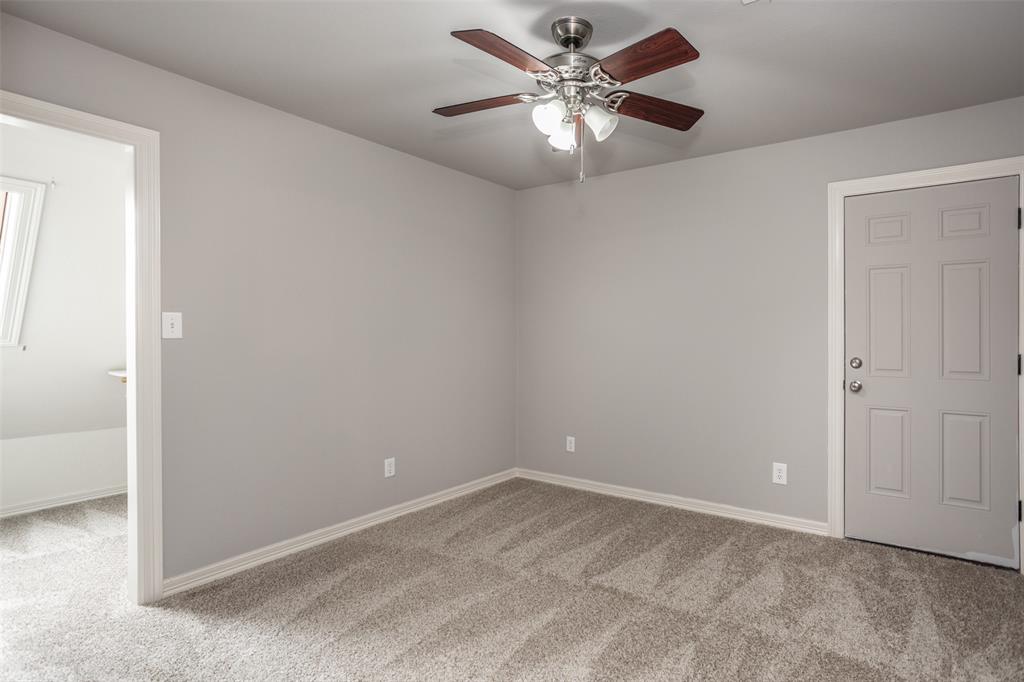 1218 Walter Street Lindsay, TX 76240 - Photo 28 of 40 an empty room with a chandelier fan