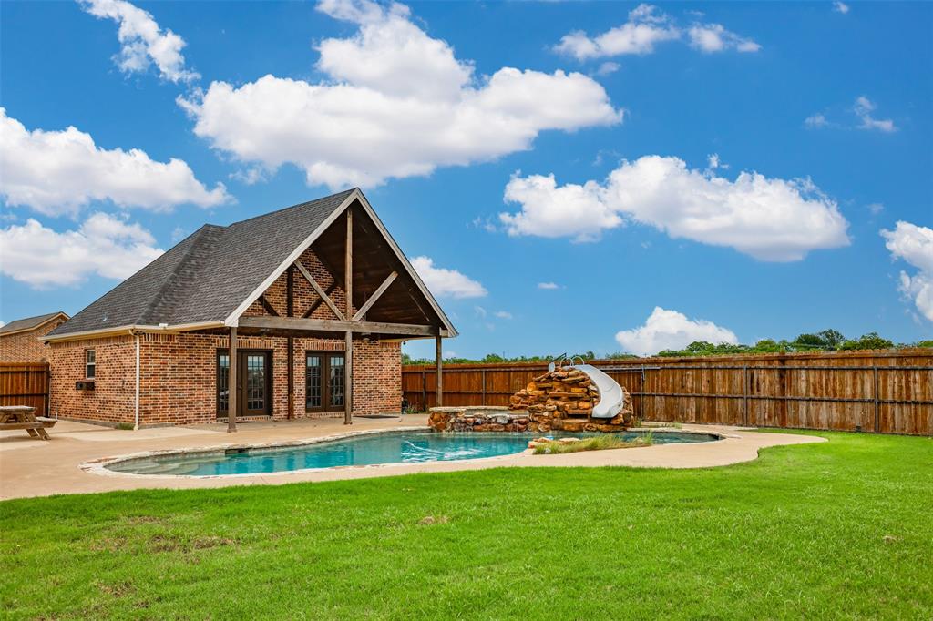 1218 Walter Street Lindsay, TX 76240 - Photo 3 of 40 a front view of a house with garden