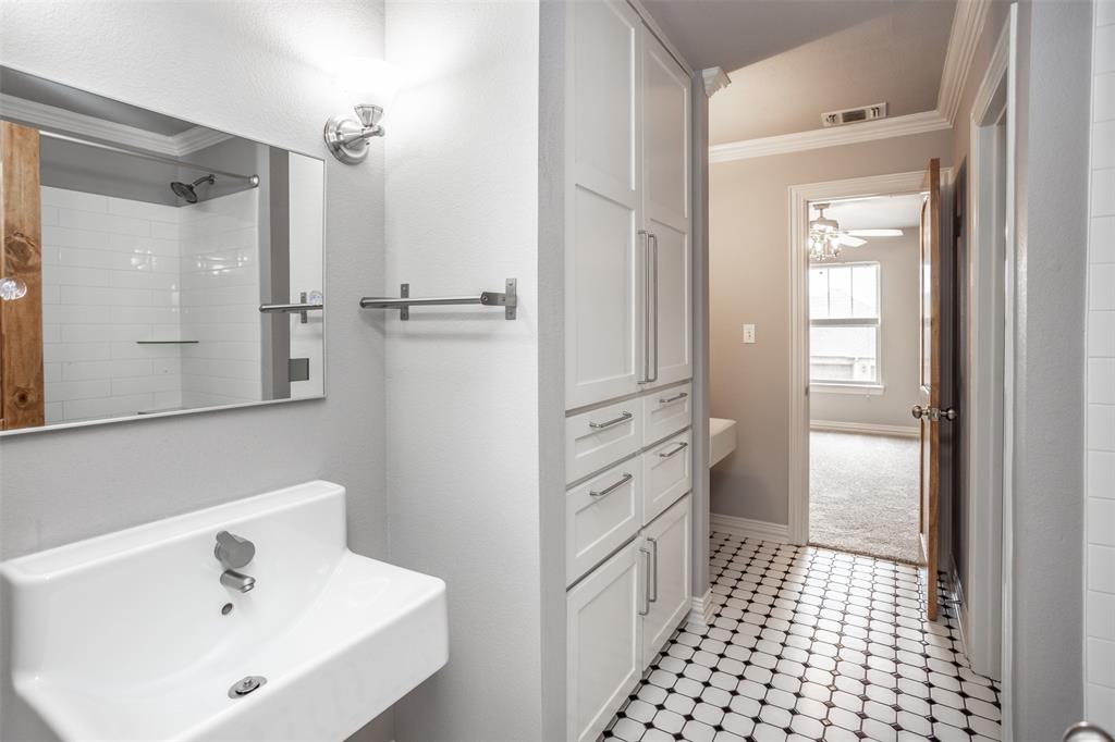 1218 Walter Street Lindsay, TX 76240 - Photo 32 of 40 a bathroom with a sink a toilet and shower