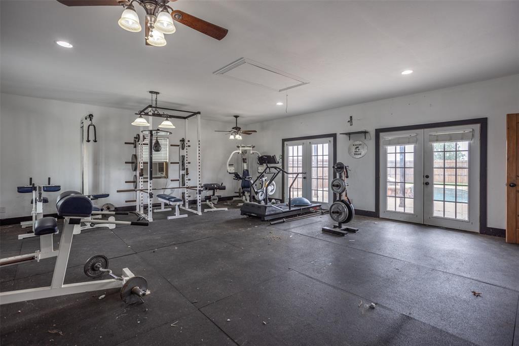 1218 Walter Street Lindsay, TX 76240 - Photo 35 of 40 a view of a room with gym equipment
