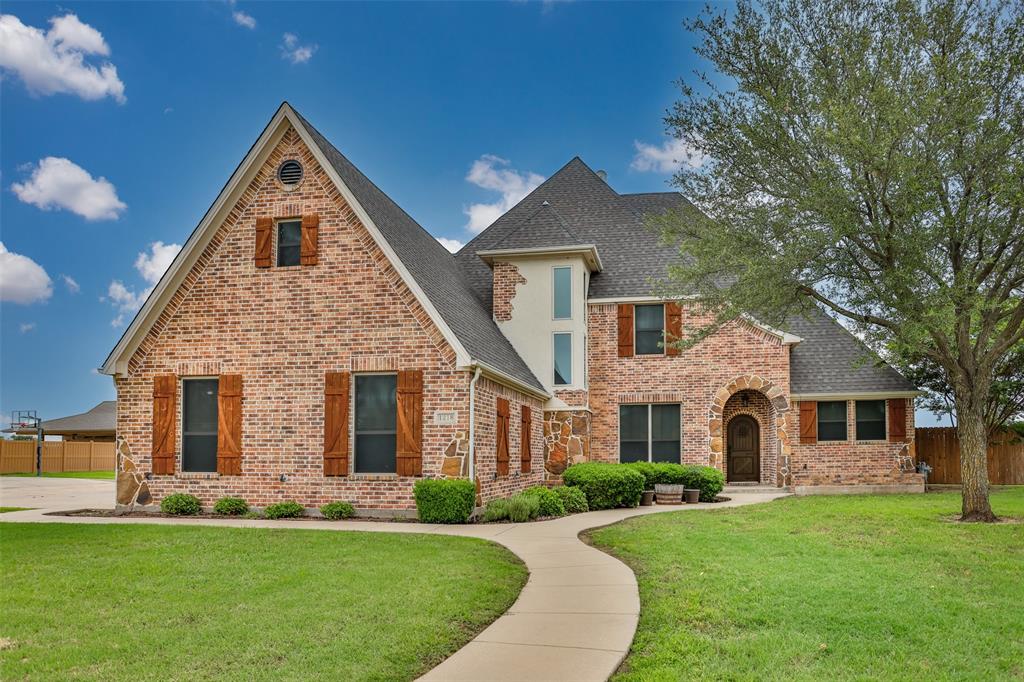 1218 Walter Street Lindsay, TX 76240 - Photo 37 of 40 a front view of a house with a garden