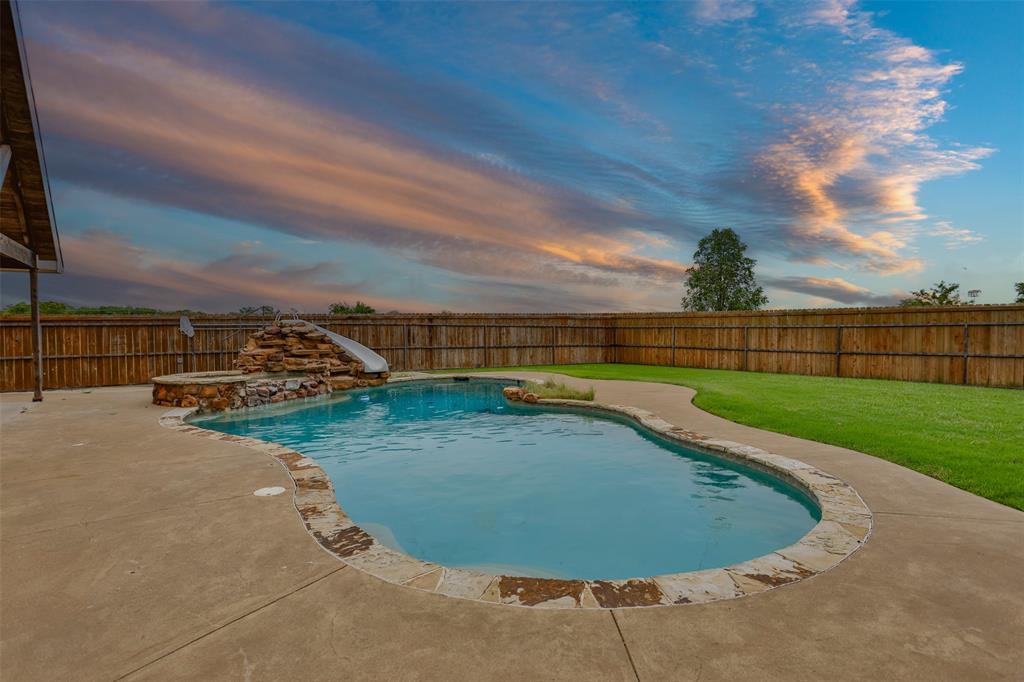 1218 Walter Street Lindsay, TX 76240 - Photo 40 of 40 a view of a swimming pool with a yard