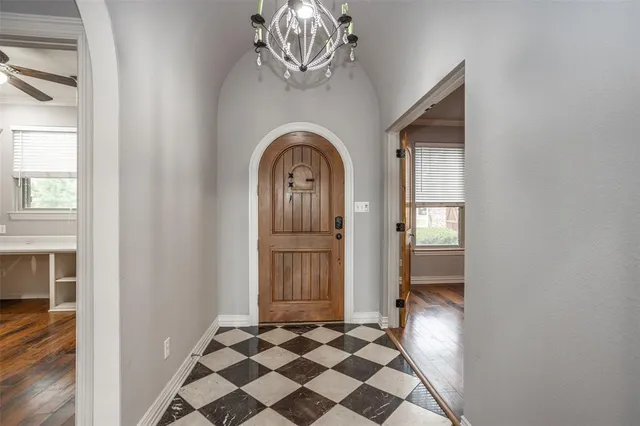 a view of a entryway door with wooden floor