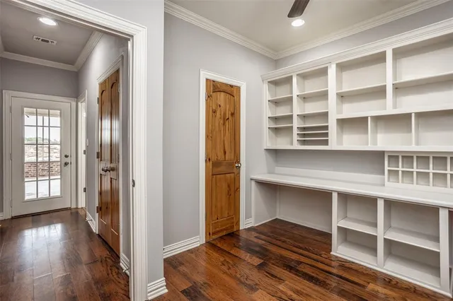 a view of wooden floor and windows in a room