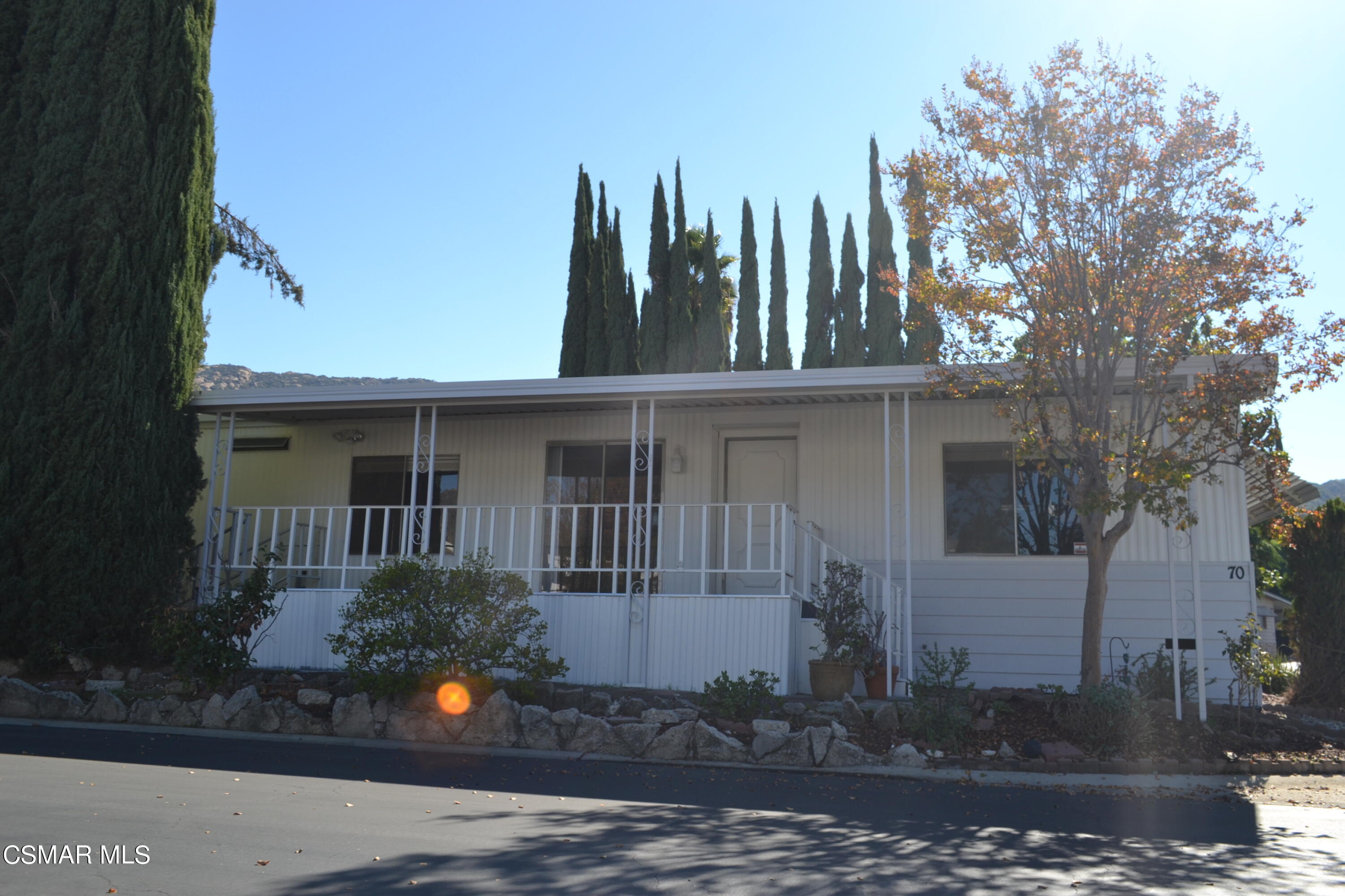 6480 Katherine Road, Unit 70 Simi Valley, CA 93063 - Photo 15 of 28 a view of a house with a garden and pathway
