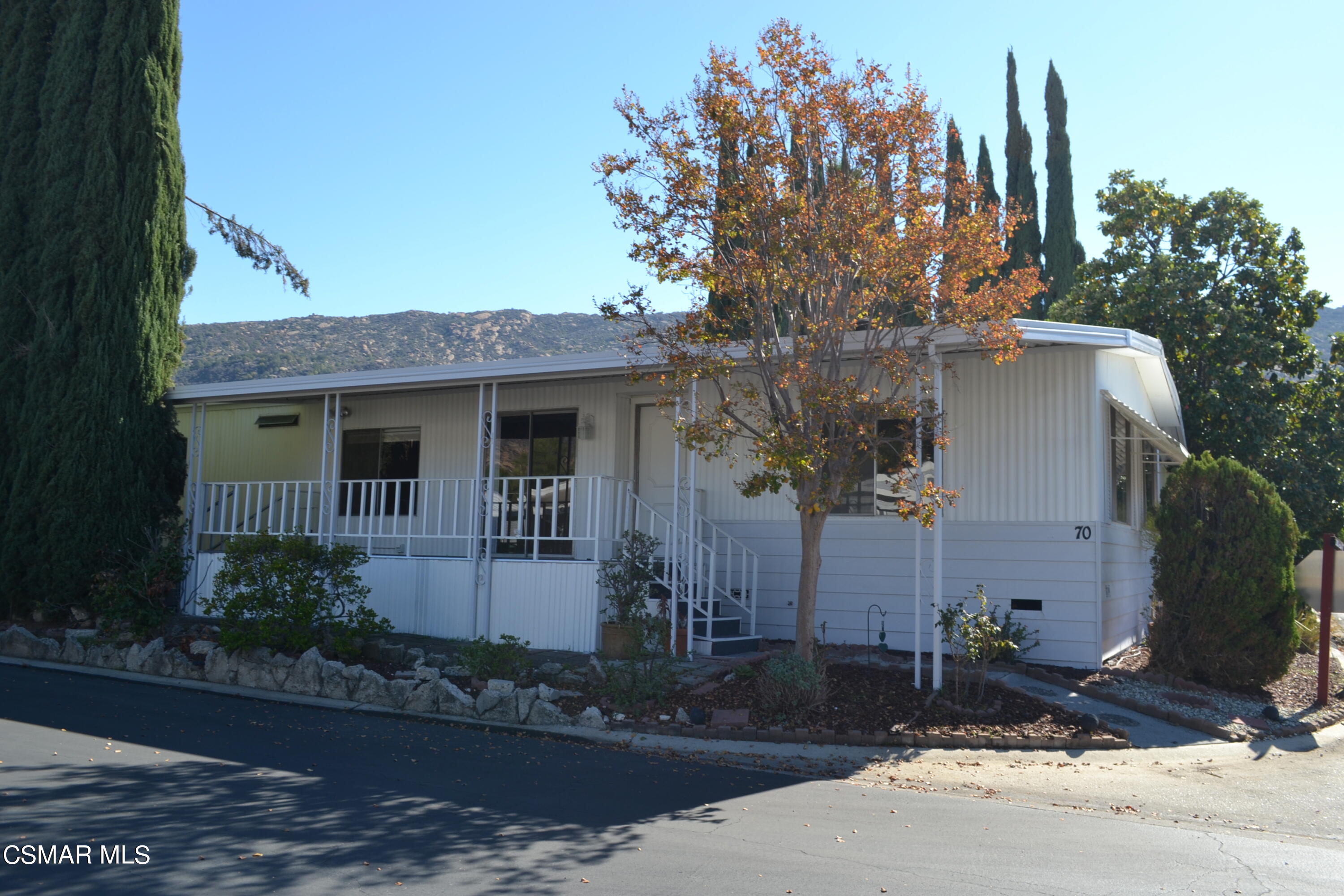 6480 Katherine Road, Unit 70 Simi Valley, CA 93063 - Photo 16 of 28 a front view of a house with garden