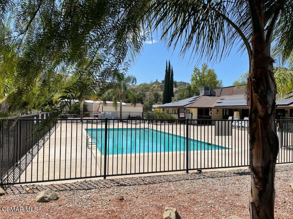 6480 Katherine Road, Unit 70 Simi Valley, CA 93063 - Photo 25 of 28 a view of a brick house with a large trees