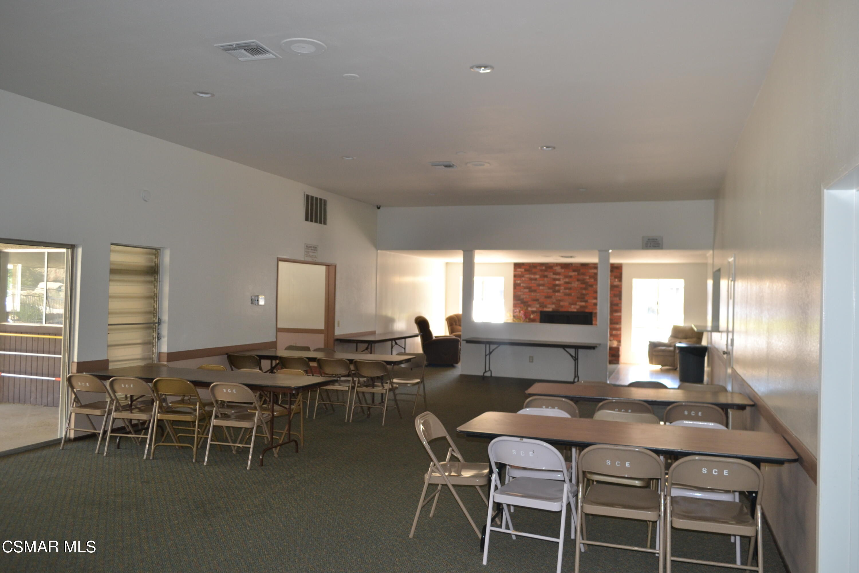 6480 Katherine Road, Unit 70 Simi Valley, CA 93063 - Photo 26 of 28 a dining hall with stainless steel appliances granite countertop a table and chairs