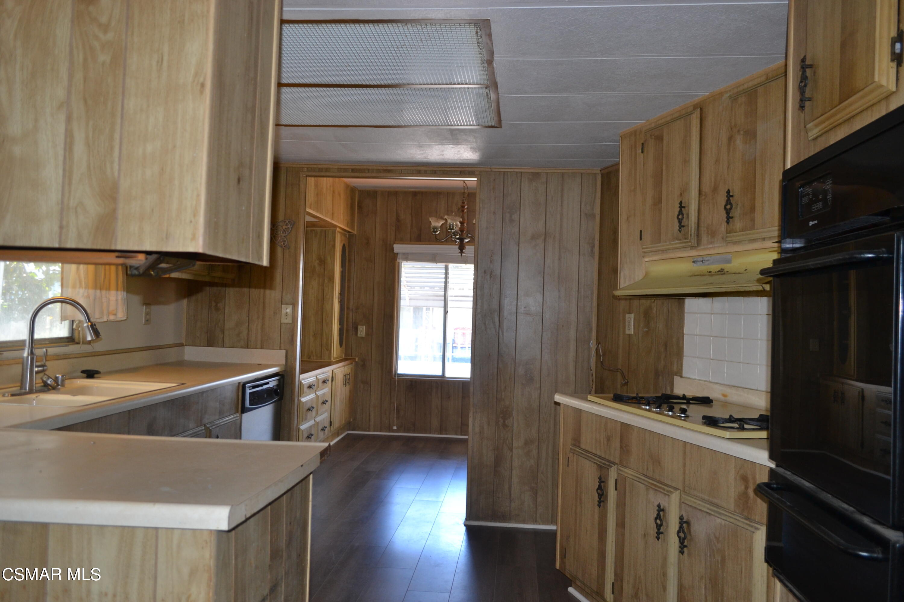 6480 Katherine Road, Unit 70 Simi Valley, CA 93063 - Photo 4 of 28 a kitchen with stainless steel appliances granite countertop a sink a stove and a refrigerator