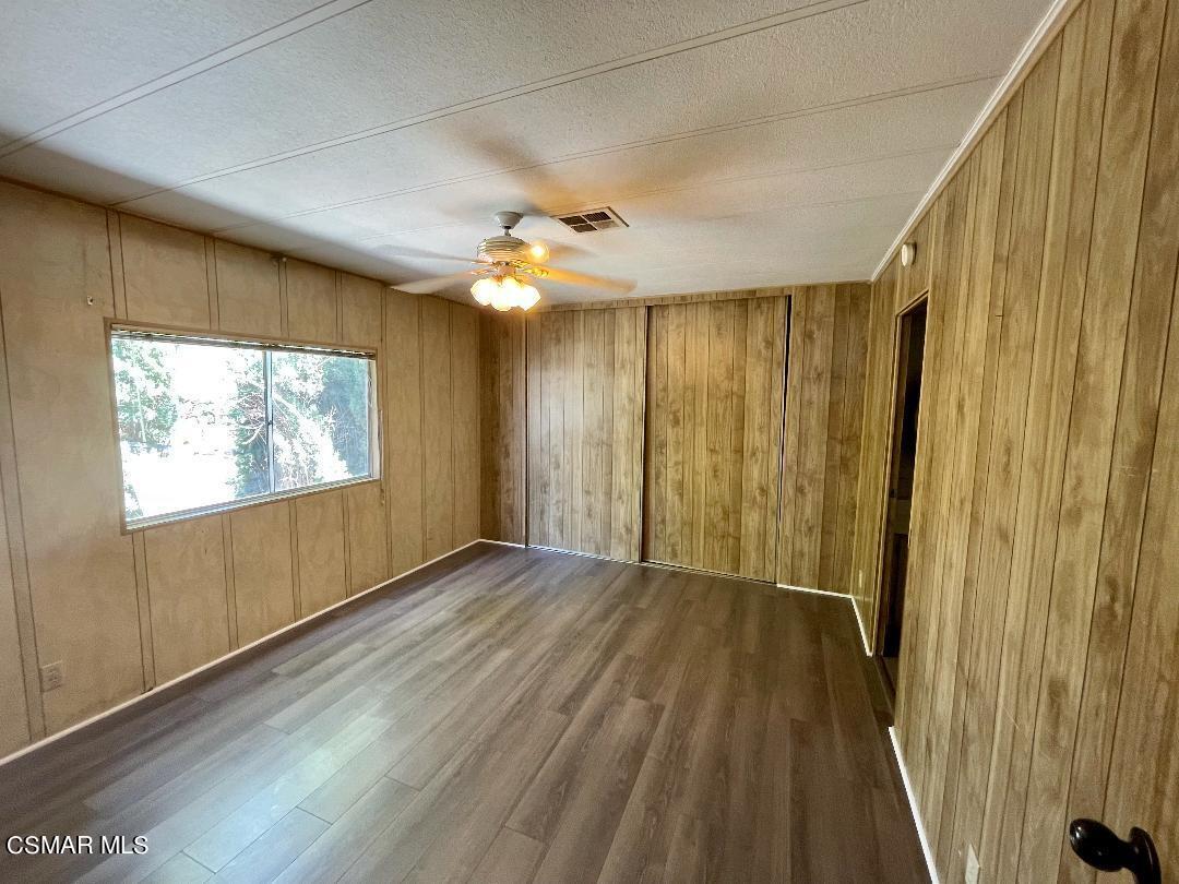 6480 Katherine Road, Unit 70 Simi Valley, CA 93063 - Photo 8 of 28 wooden floor in an empty room with a window
