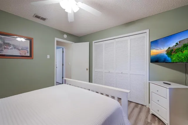 an aerial view of a residential houses with city view