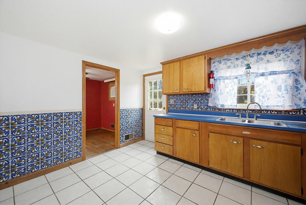 111 Almy Road Somerset, MA 02726 - Photo 13 of 42 a spacious bathroom with a sink mirror and shower