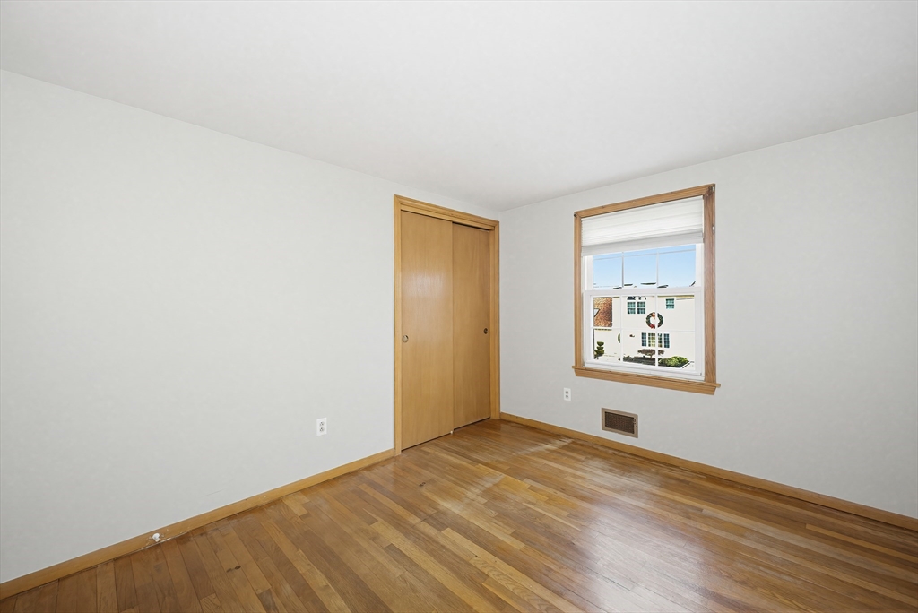 111 Almy Road Somerset, MA 02726 - Photo 20 of 42 a view of empty room with wooden floor and fan