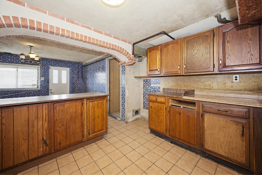 111 Almy Road Somerset, MA 02726 - Photo 29 of 42 a kitchen with stainless steel appliances granite countertop a refrigerator