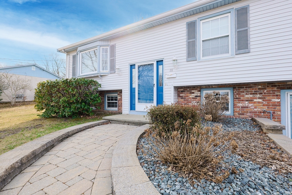 111 Almy Road Somerset, MA 02726 - Photo 4 of 42 a front view of a house with garden