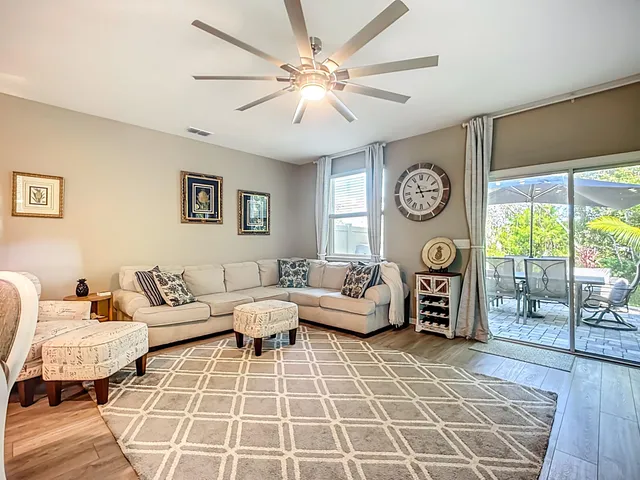 a dining room with furniture a window and kitchen view