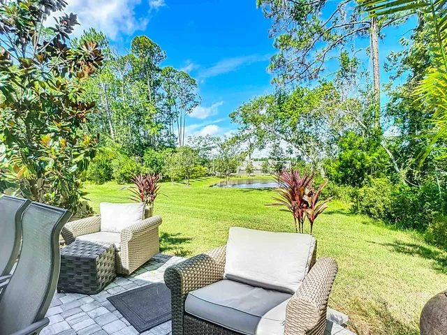 a patio with a yard table and chairs