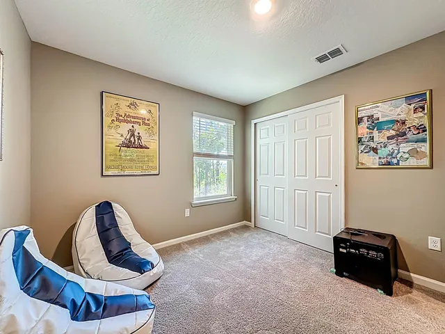 a bathroom with a double vanity sink toilet and shower