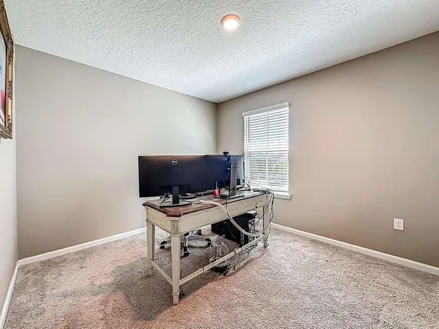 a view of workspace with flat screen tv