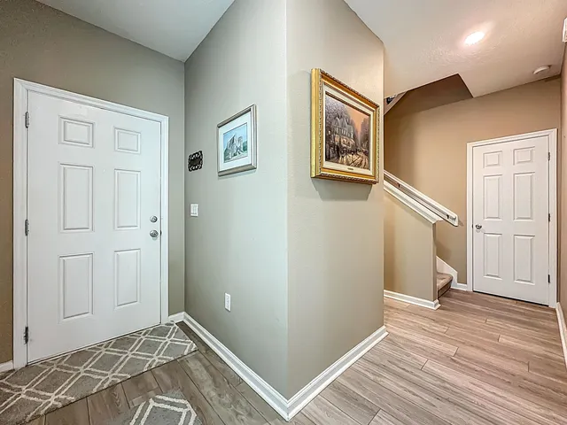 a view of a bedroom with wooden floor and closet