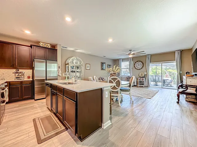 a kitchen with stainless steel appliances granite countertop a stove and cabinets