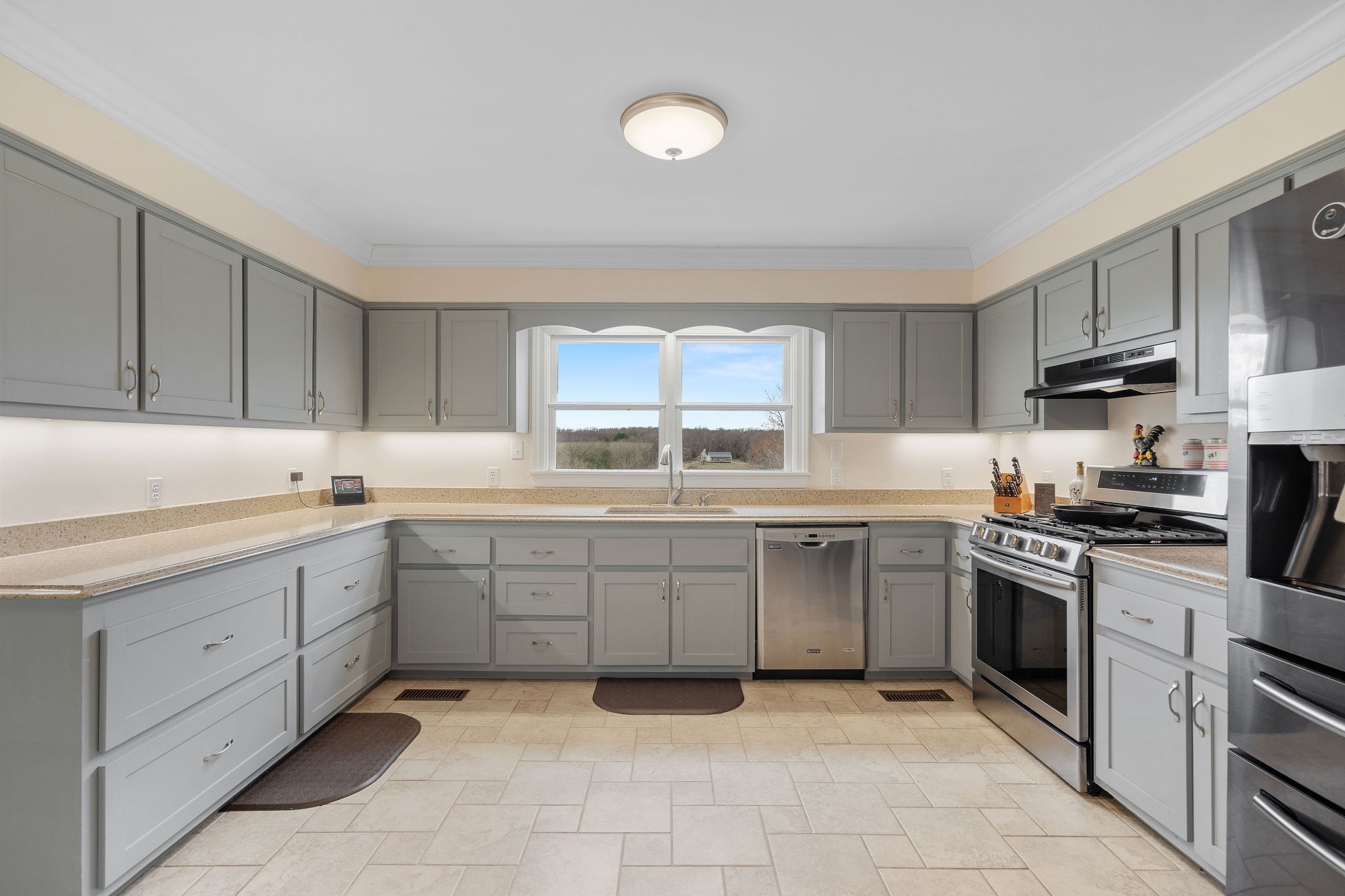 1280 Bold Springs Road McEwen, TN 37101 - Photo 11 of 66 a kitchen with a sink stove and wooden cabinets