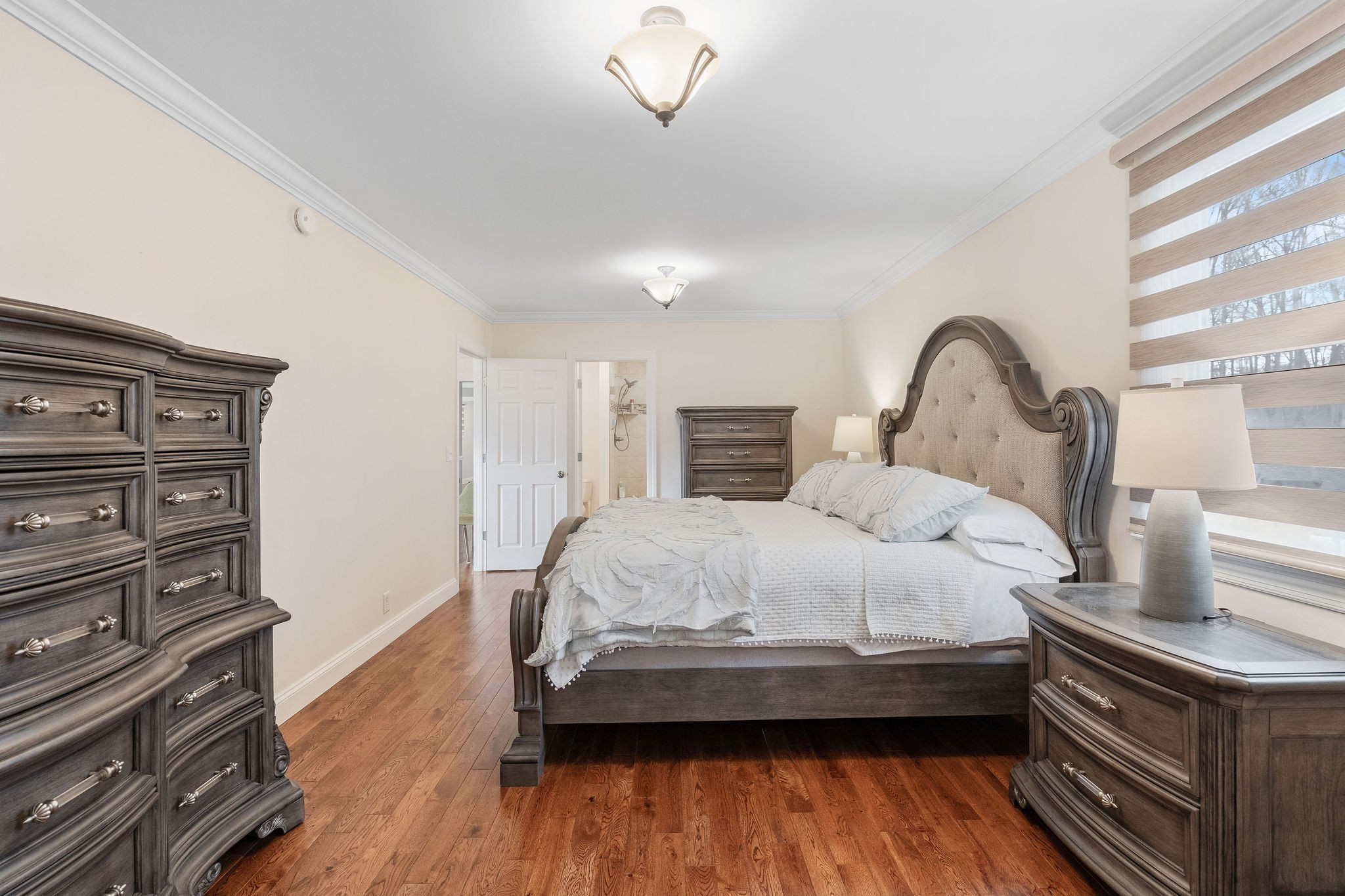 1280 Bold Springs Road McEwen, TN 37101 - Photo 21 of 66 a bedroom with a bed and a dresser