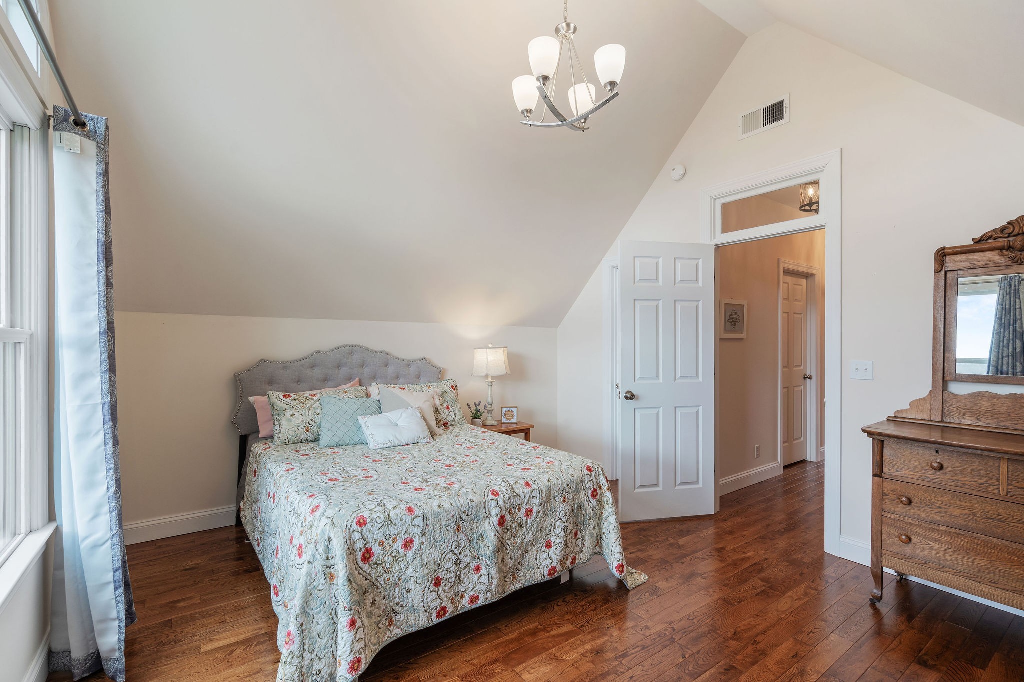1280 Bold Springs Road McEwen, TN 37101 - Photo 28 of 66 a bedroom with a bed and wooden floor