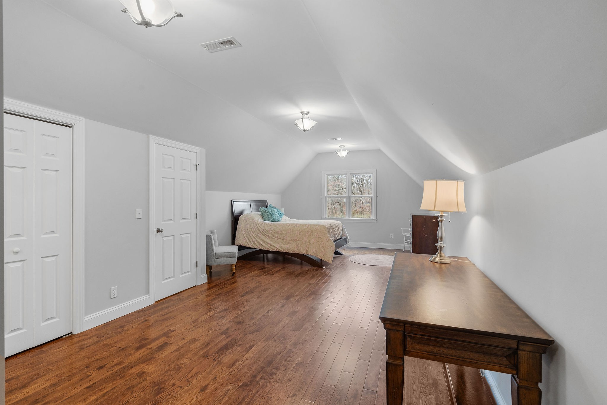 1280 Bold Springs Road McEwen, TN 37101 - Photo 33 of 66 a spacious bedroom with a bed and a table in it