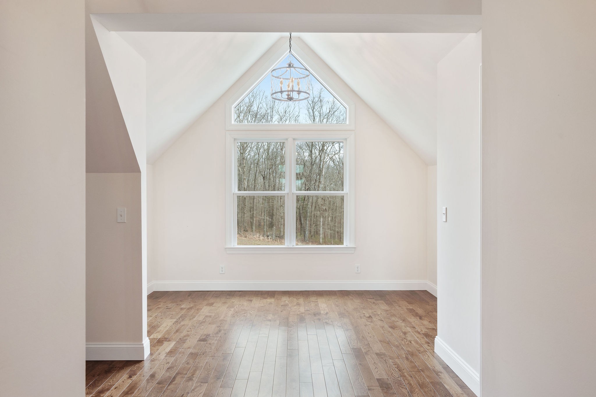 1280 Bold Springs Road McEwen, TN 37101 - Photo 34 of 66 an empty room with wooden floor and windows