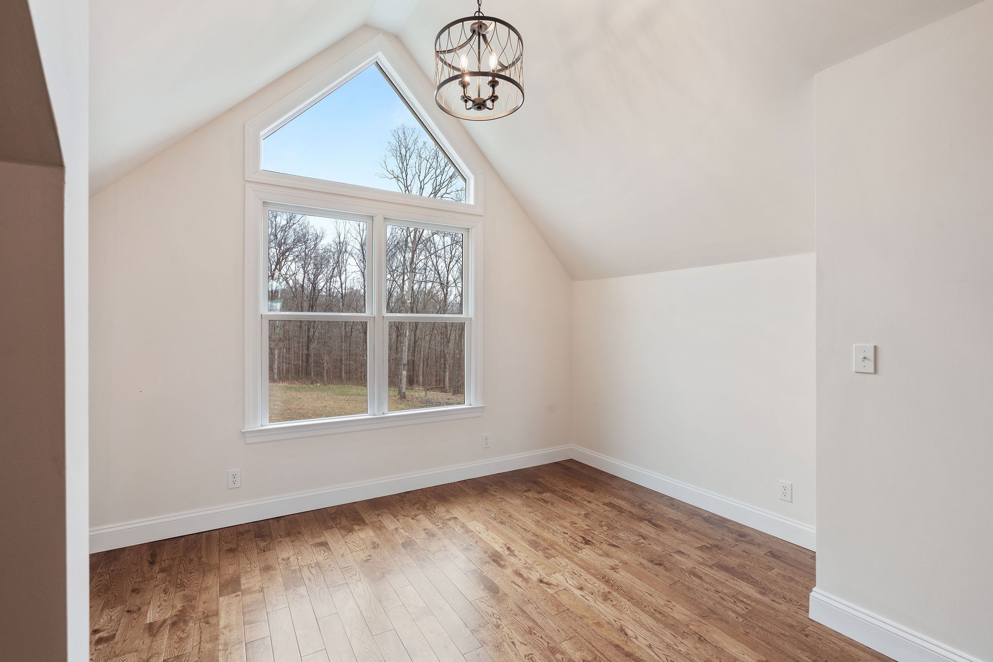 1280 Bold Springs Road McEwen, TN 37101 - Photo 35 of 66 an empty room with wooden floor fan and windows