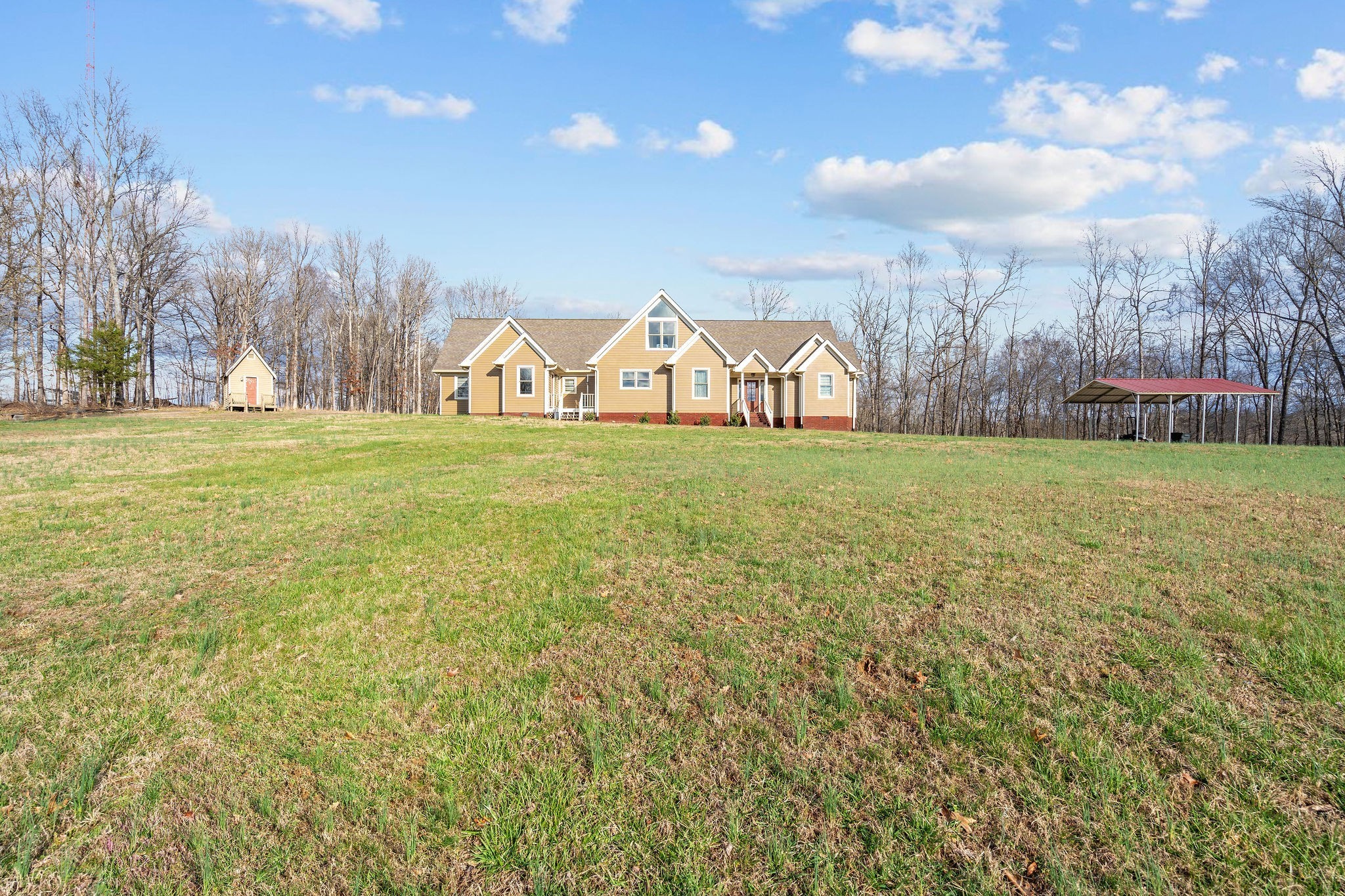 1280 Bold Springs Road McEwen, TN 37101 - Photo 5 of 66 a view of a big yard with an tree and a wooden fence