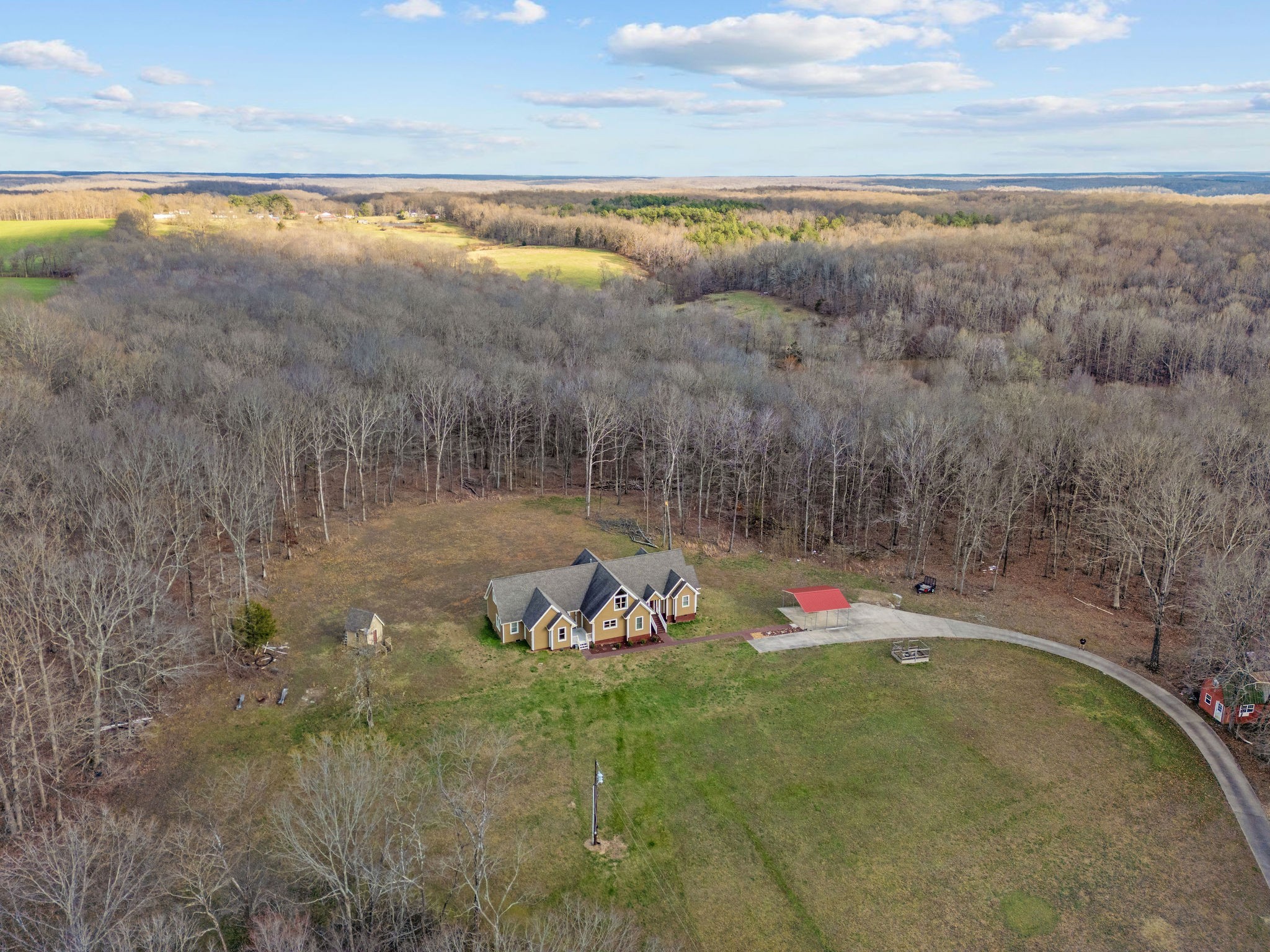 1280 Bold Springs Road McEwen, TN 37101 - Photo 53 of 66 a backyard of a house with table and chairs