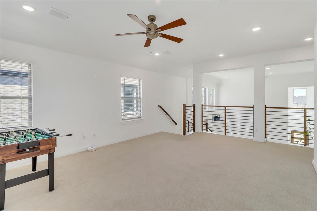 1241 Lupine Road Prosper, TX 75078 - Photo 26 of 38 Spacious bonus room featuring neutral carpeting, a ceiling fan with integrated lighting, recessed lighting, and multiple windows with blinds