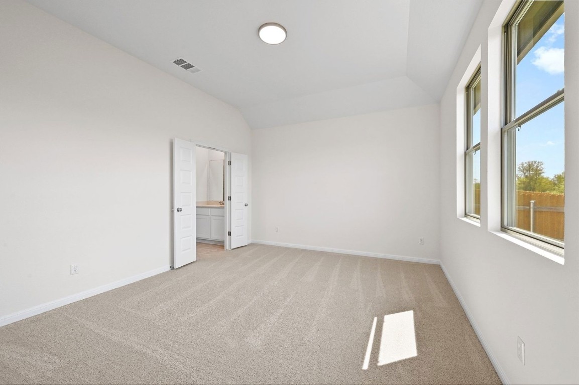 270 Bendecido Loop Elgin, TX 78621 - Photo 14 of 39 an empty room with windows