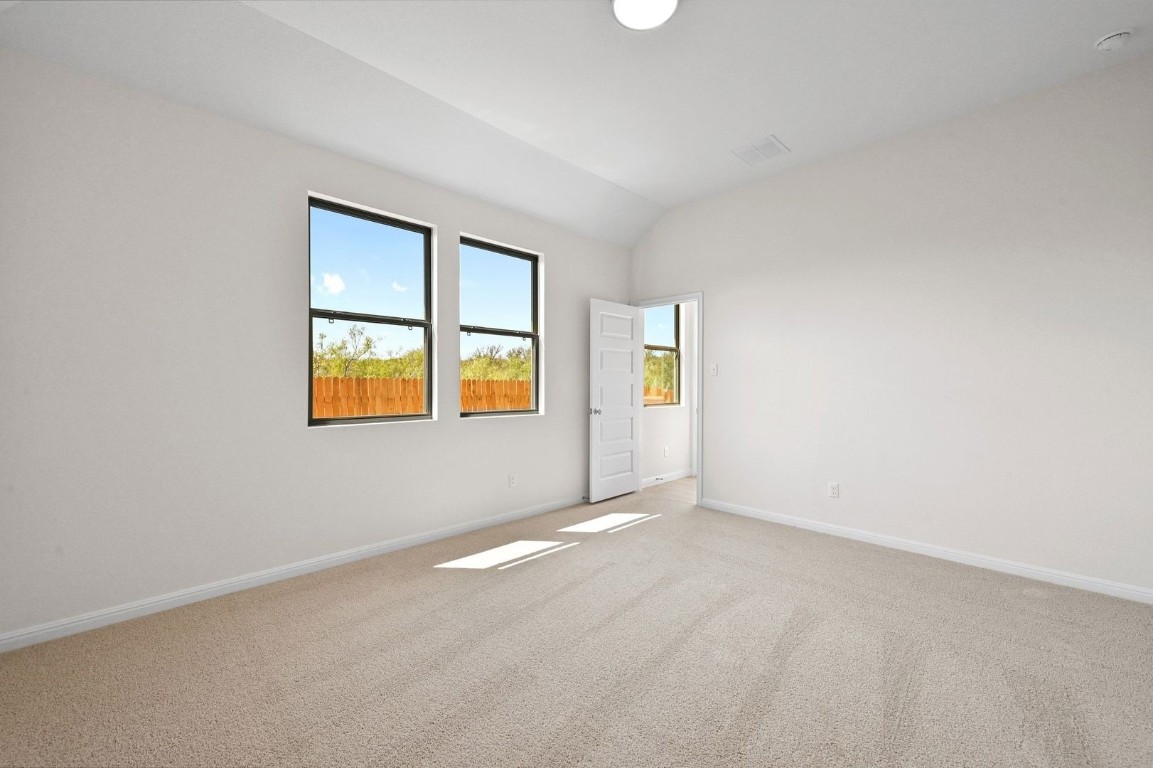 270 Bendecido Loop Elgin, TX 78621 - Photo 15 of 39 an empty room with windows