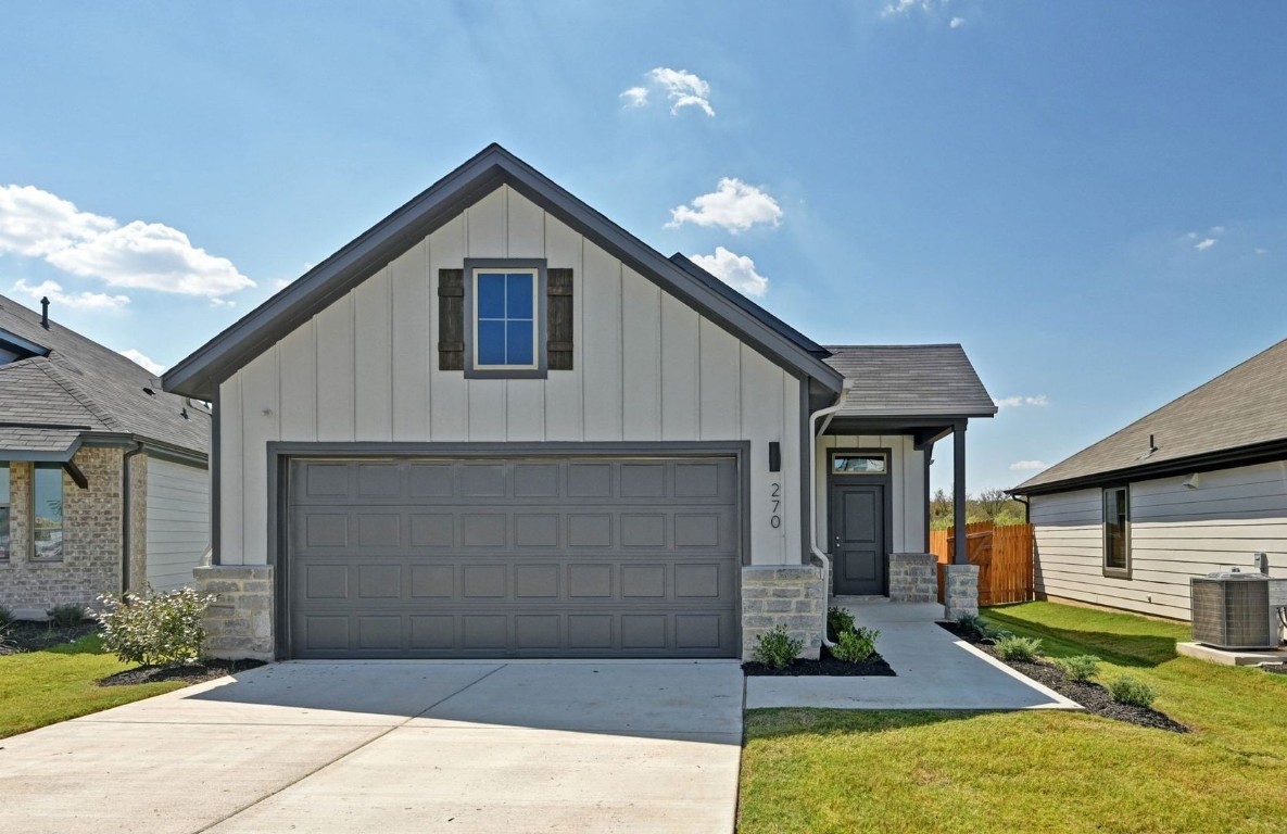 270 Bendecido Loop Elgin, TX 78621 - Photo 2 of 39 a front view of a house with garage