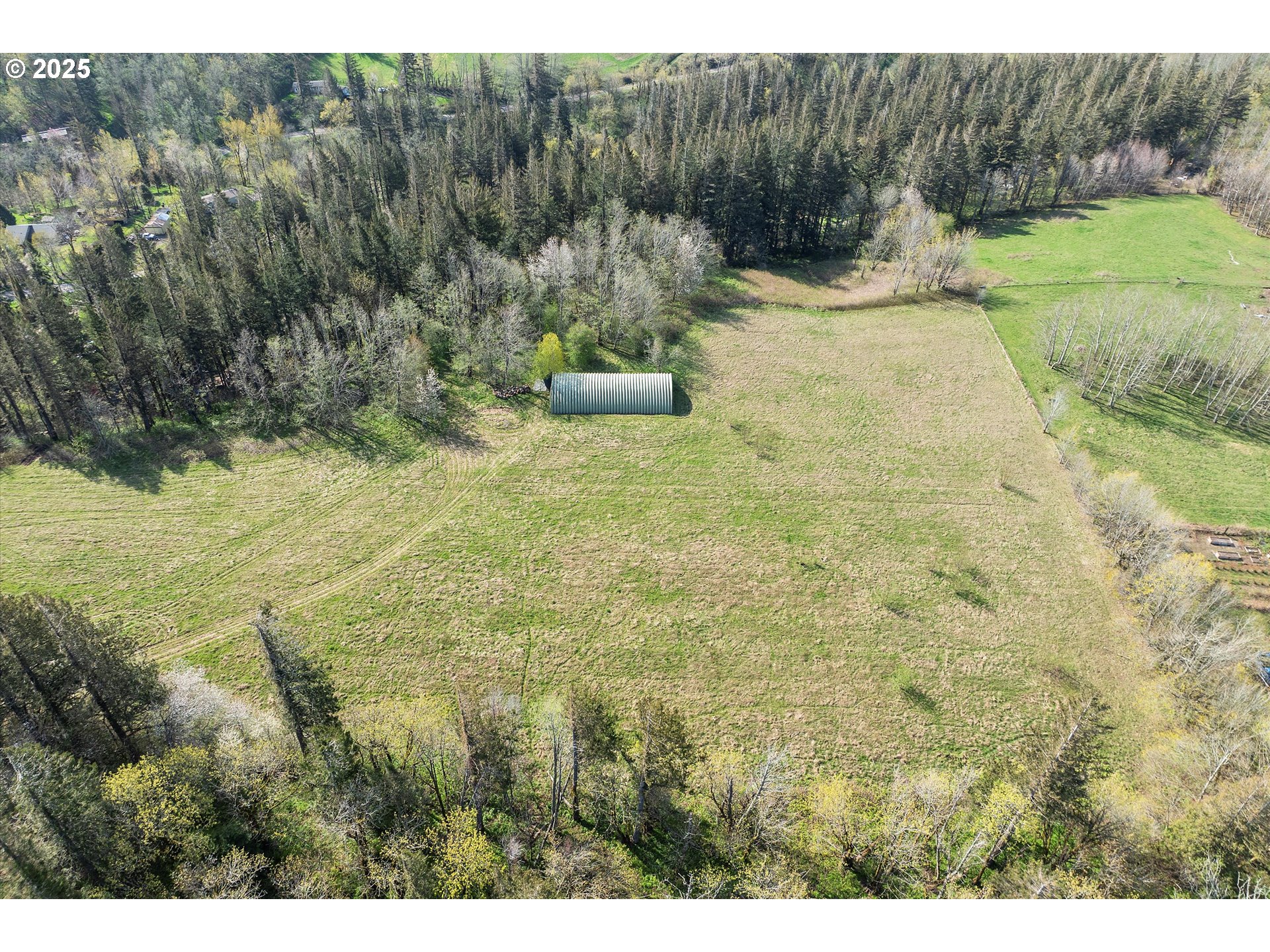 39149 East Knieriem Road Corbett, OR 97019 - Photo 8 of 16 a backyard of a house with a yard and outdoor seating