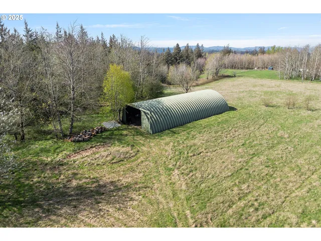 a view of a backyard with trees
