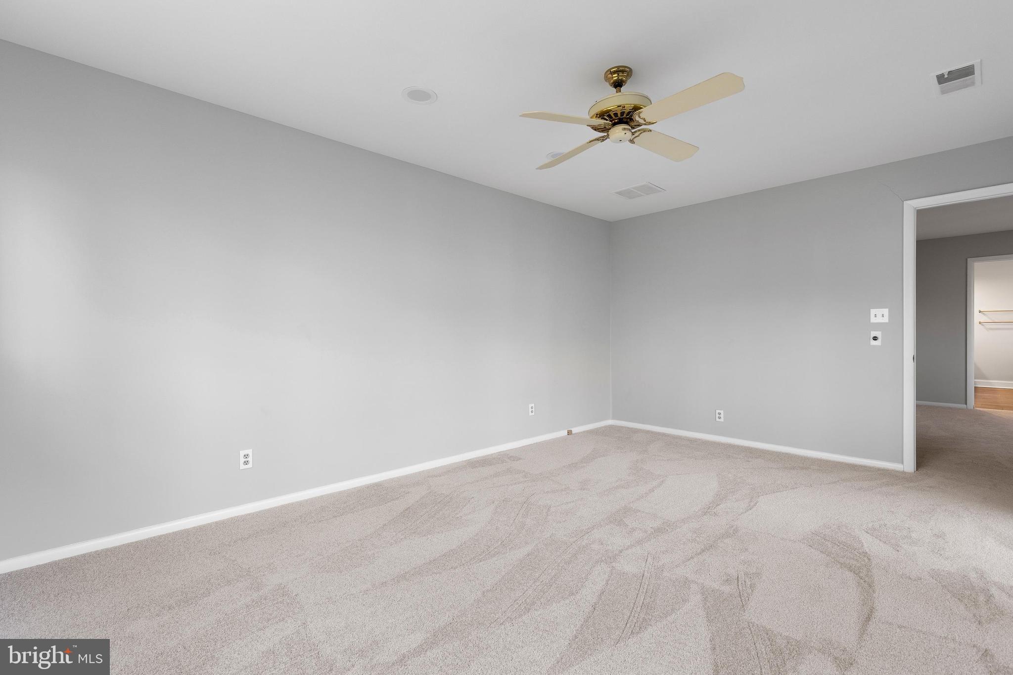 10 Brandywine Falls Road, Unit C010 Wilmington, DE 19806 - Photo 23 of 29 a view of an empty room with a ceiling fan