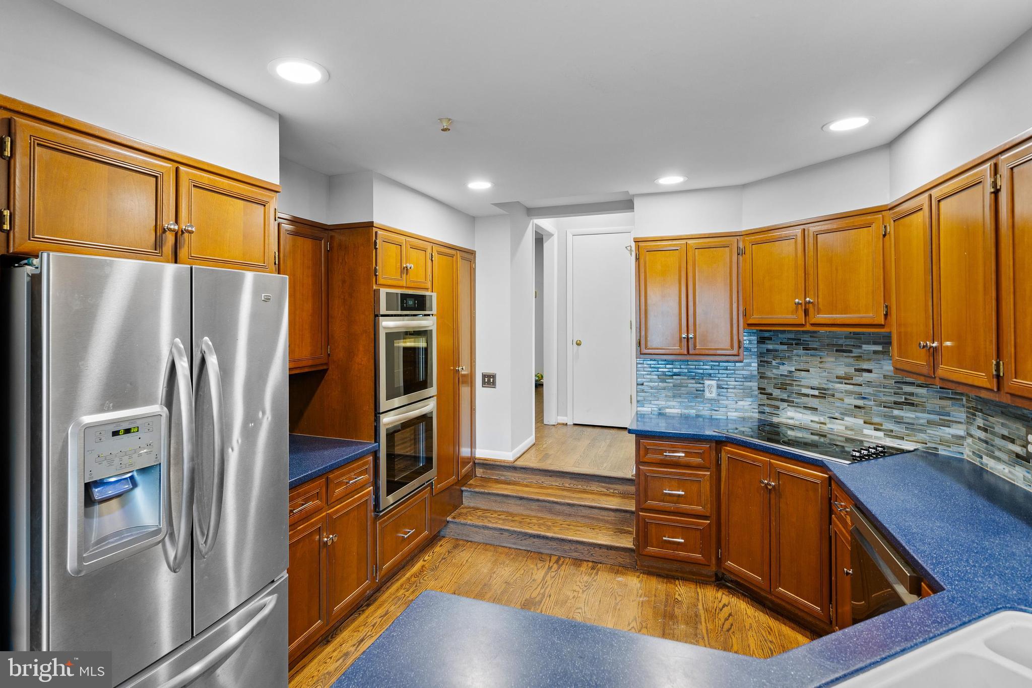 10 Brandywine Falls Road, Unit C010 Wilmington, DE 19806 - Photo 5 of 29 a kitchen with stainless steel appliances granite countertop a refrigerator and a stove