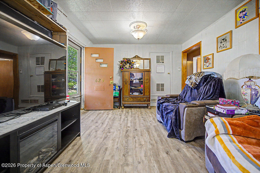 625 Russell Street Craig, CO 81625 - Photo 16 of 35 a living room with furniture and a flat screen tv