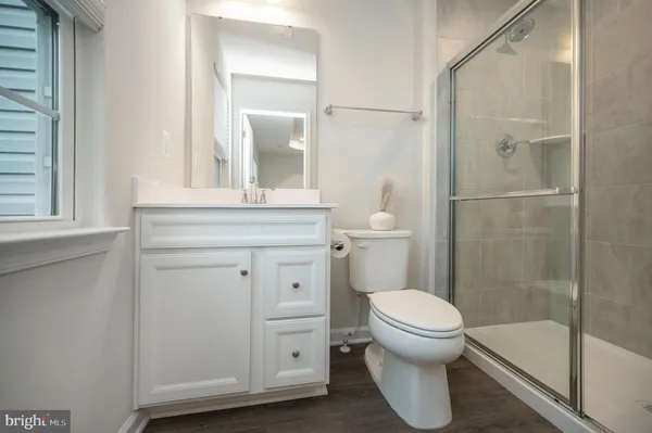 a bathroom with a glass shower door