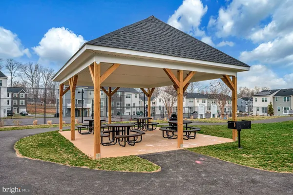 a swimming pool with outdoor seating and yard