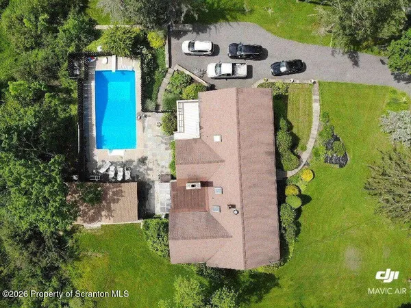 an aerial view of a house with a garden